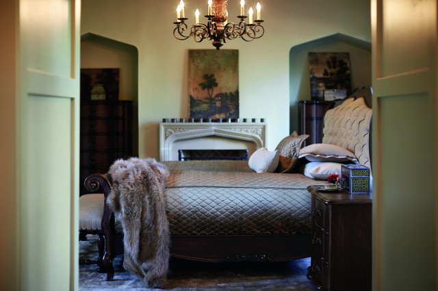 Tufted Sleigh Bed with exposed wood frame
