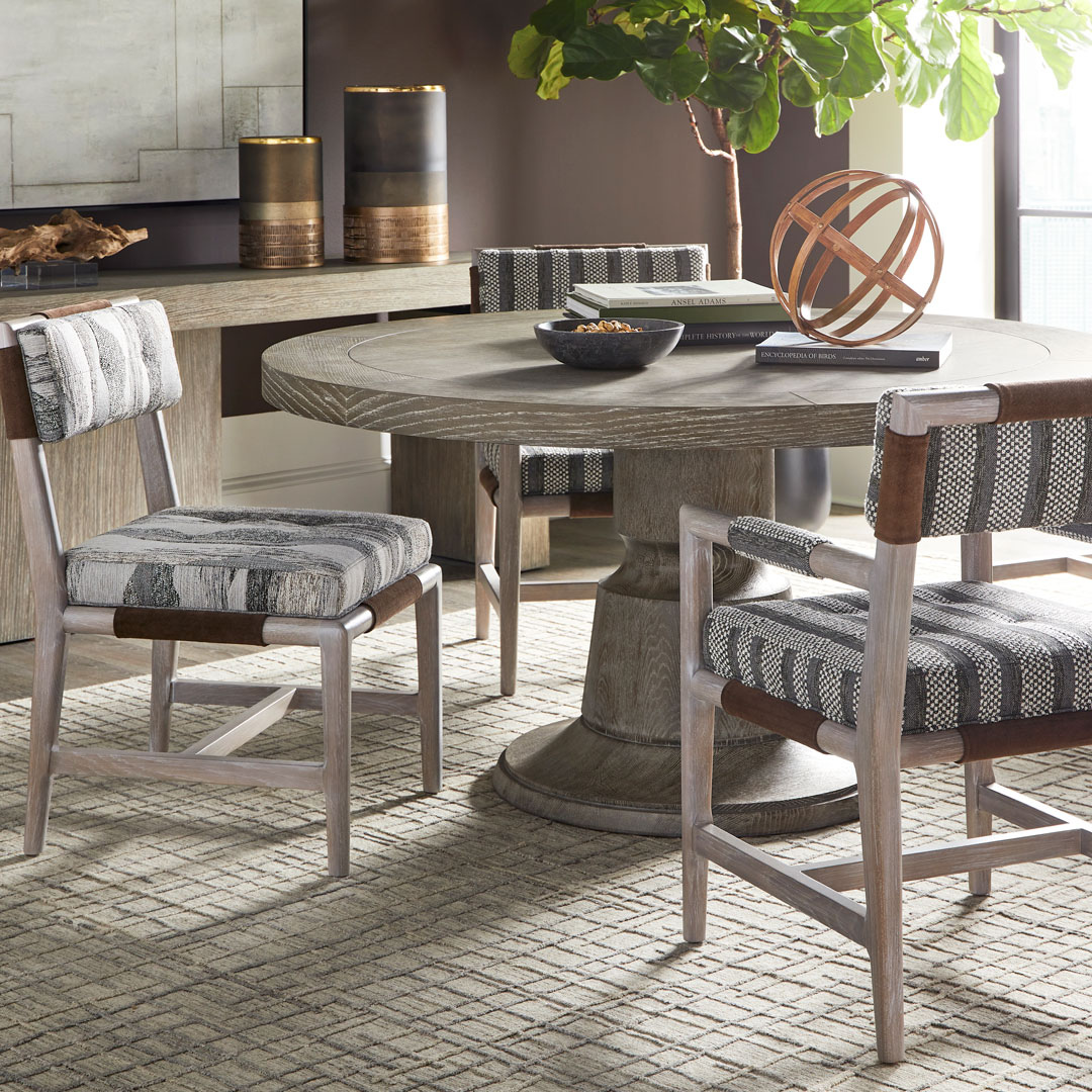 Solid wood round dining table with custom finish in Denver luxury home