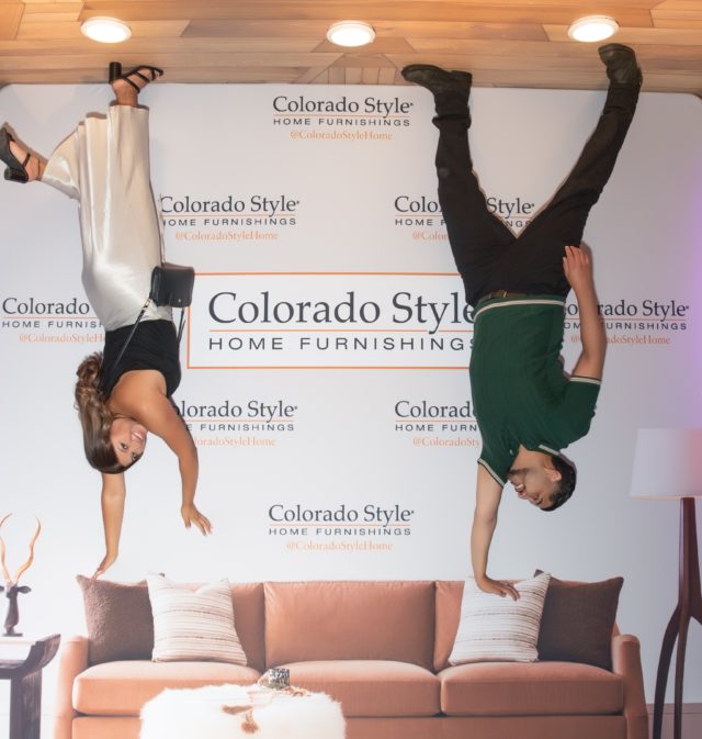 Guests enjoying upside down sofa installation by Colorado Style Home Furnishings at Parker Colorado charity event