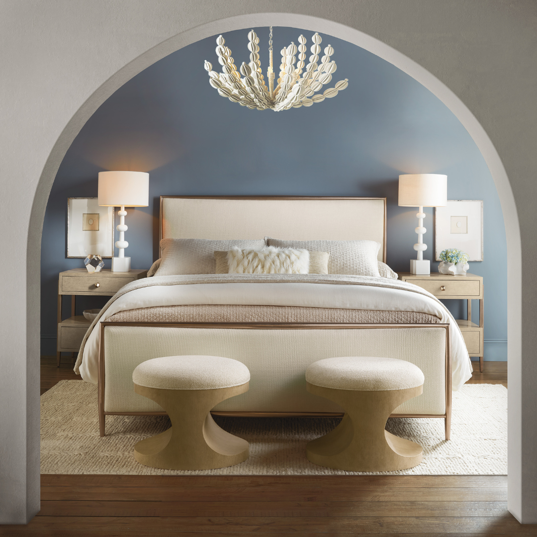 Luxury bedroom with upholstered bed, matching nightstands, table lamps, and symmetrical design in a contemporary Denver home.
