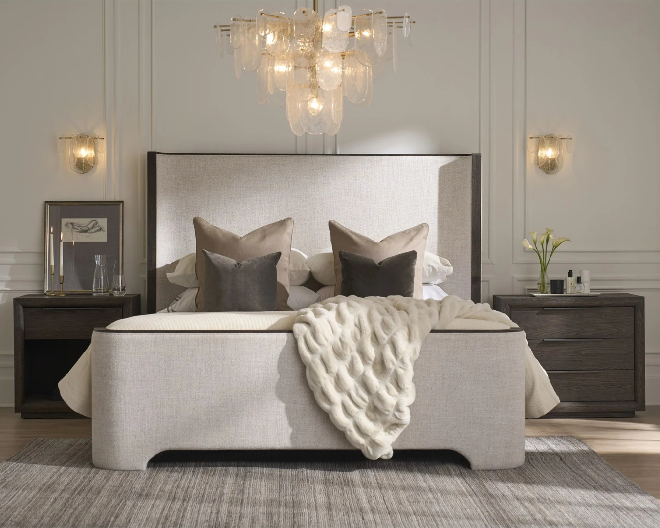 Luxury upholstered king bed with textured fabric and symmetrical nightstands in a contemporary bedroom at a Denver luxury furniture showroom.