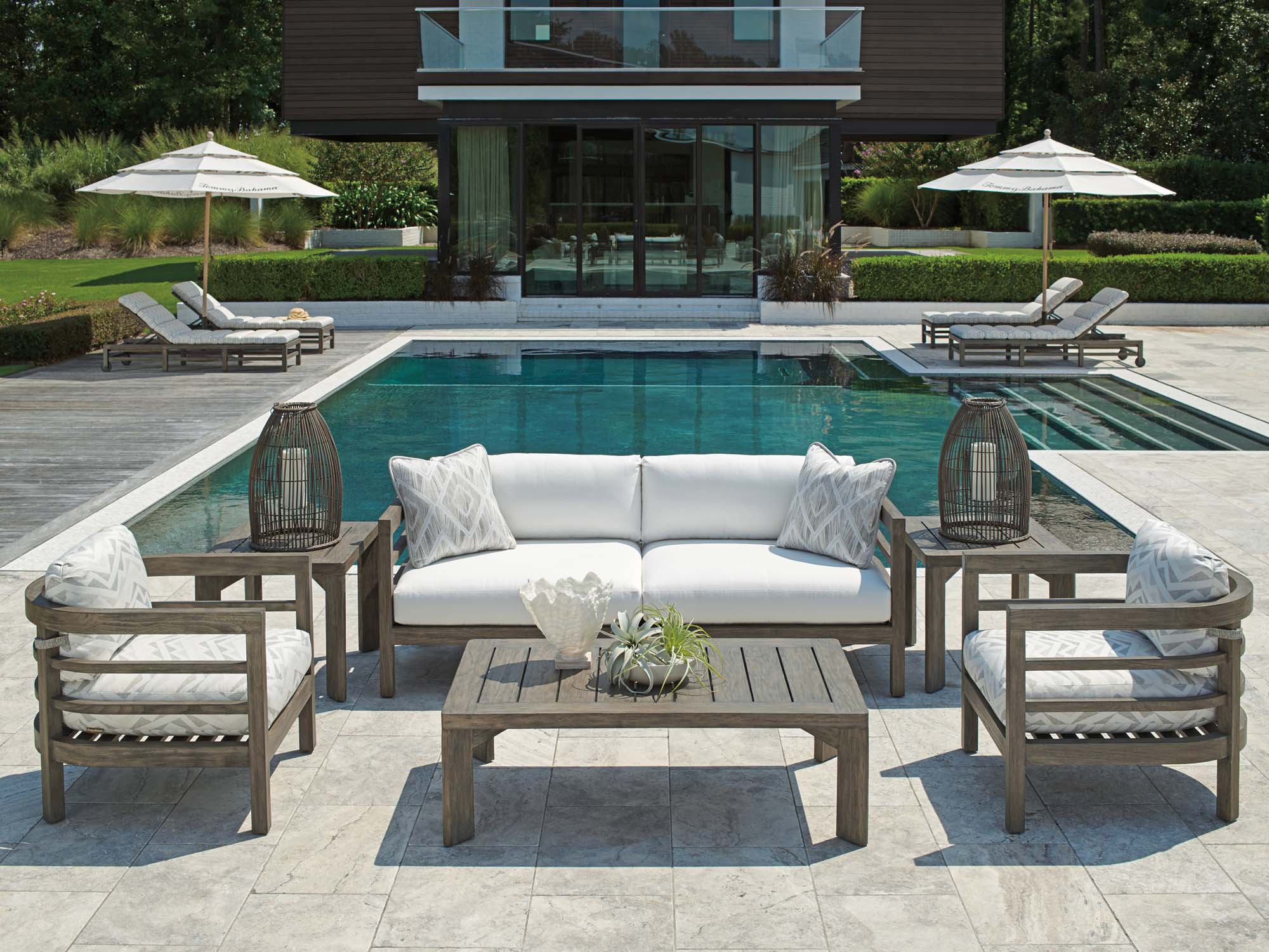 Luxury outdoor patio furniture with poolside seating and modern outdoor living design in Denver.