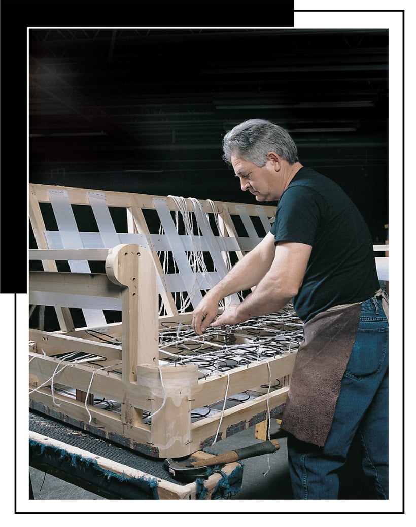 Worker building a leather sofa