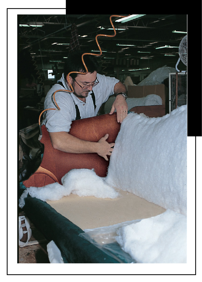 Worker building a leather sofa